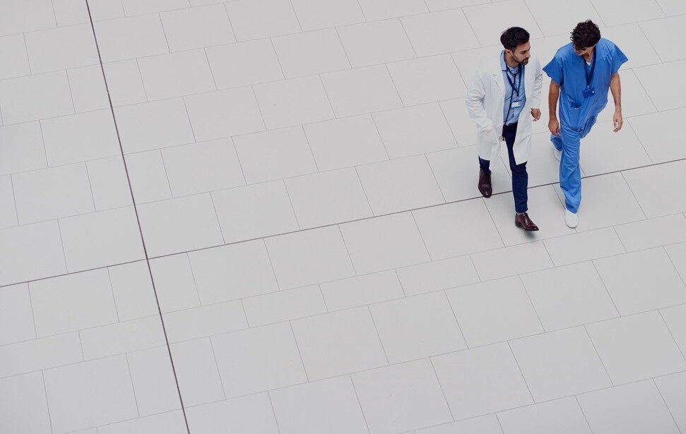 Nurse and doctor walking beside each other