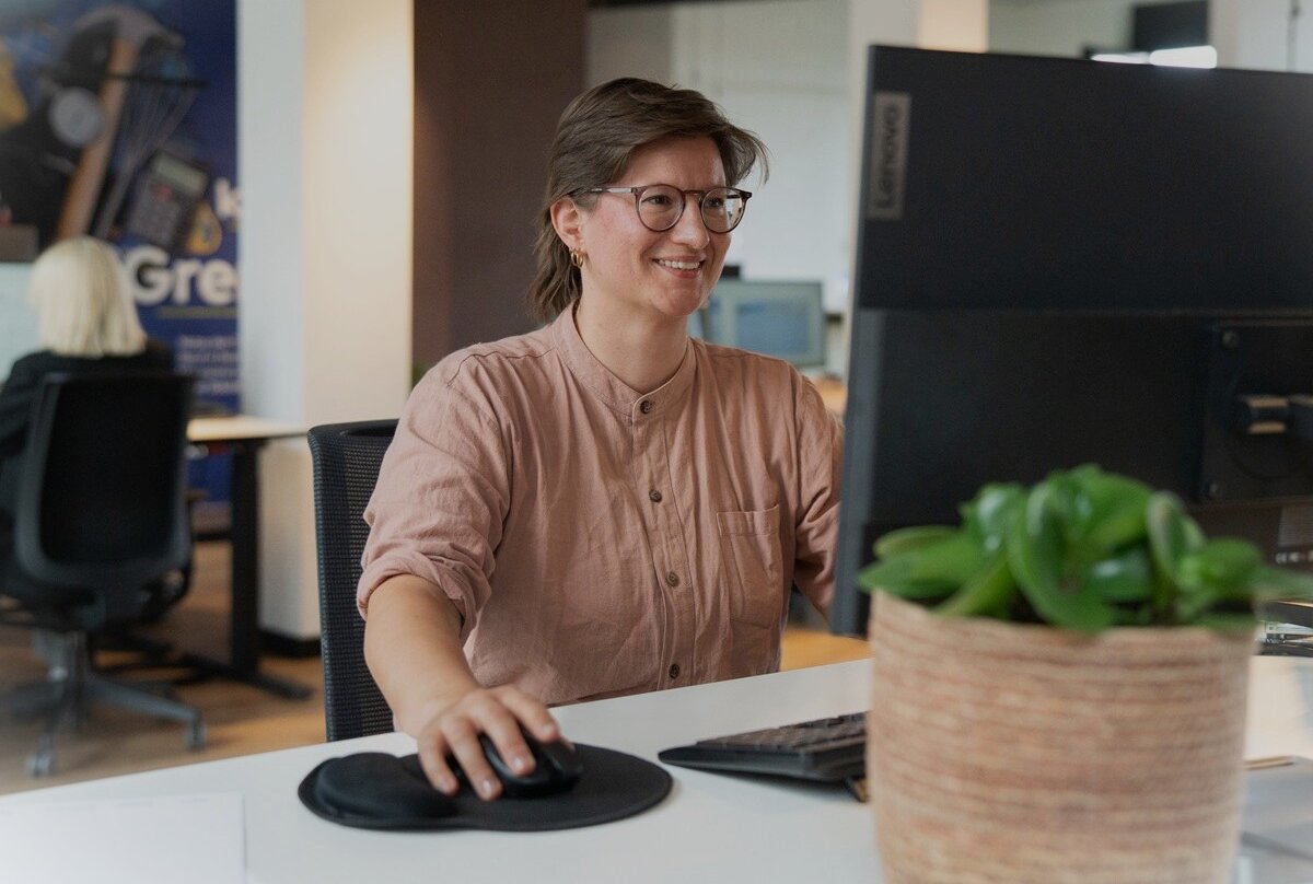 Translator sitting at computer