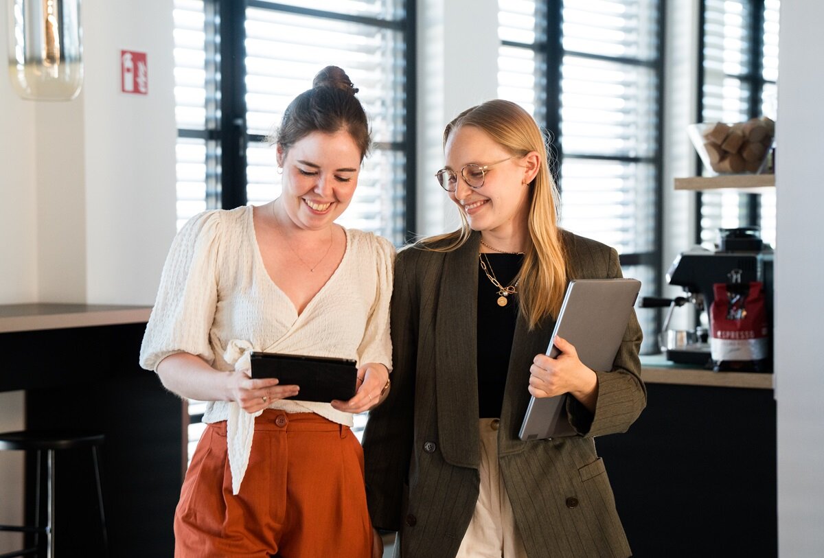 lingoking employees looking into tablet