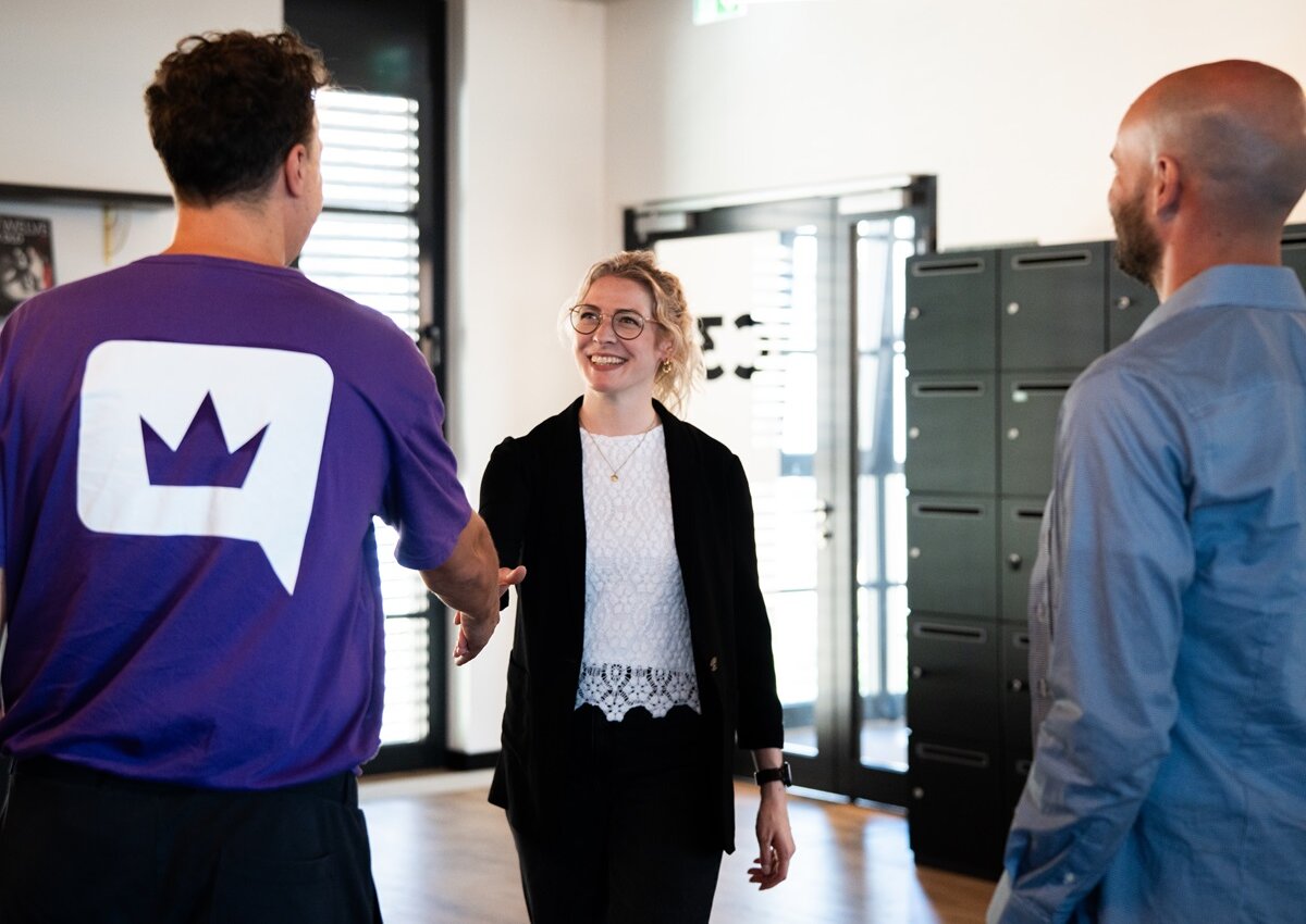 lingoking employee shaking hands with another person