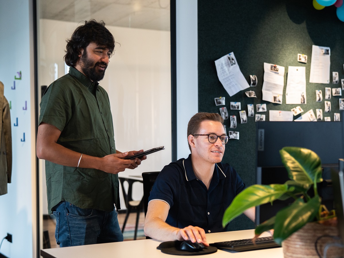 Two people looking into PC