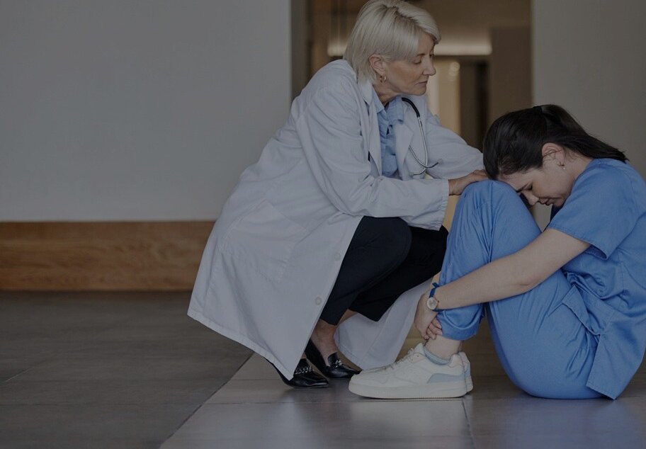 Doctor comforts nurse